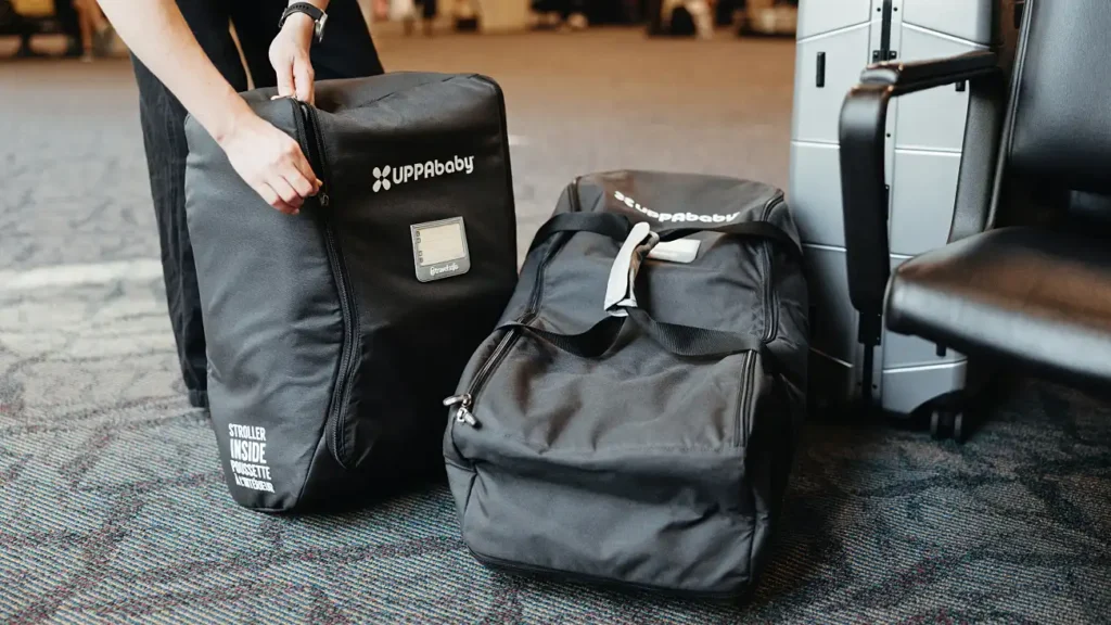 Parent zipping travel bags before travel