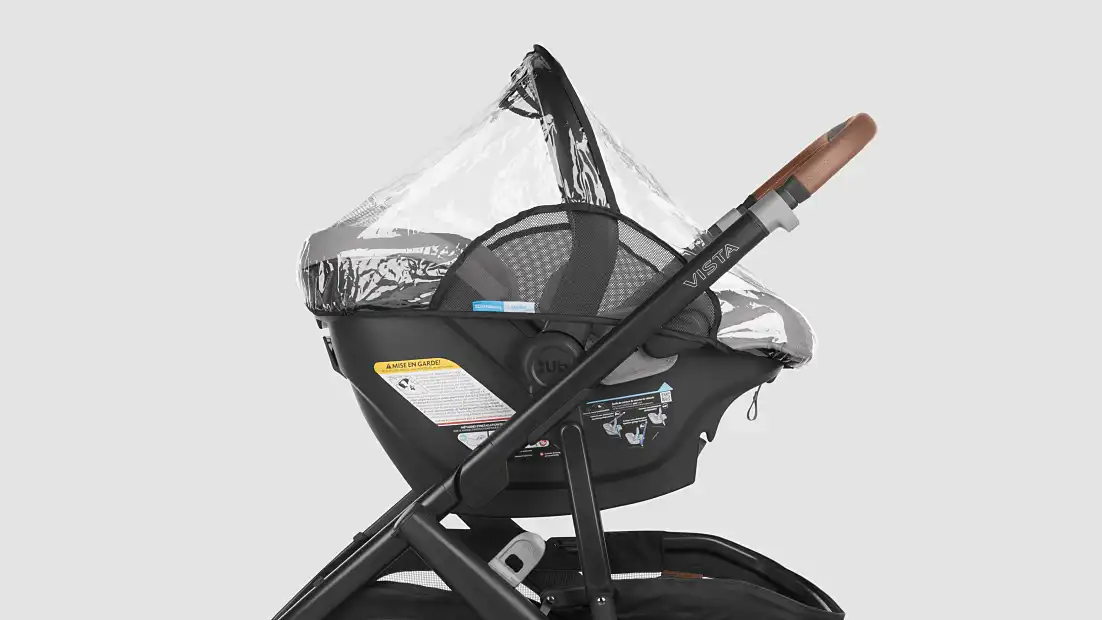 rain shield on car seat, attached to stroller